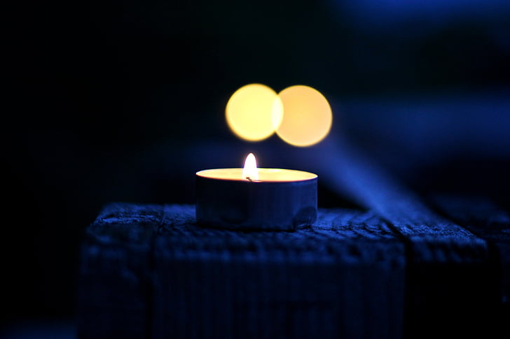 lit tealight candle bokeh photography