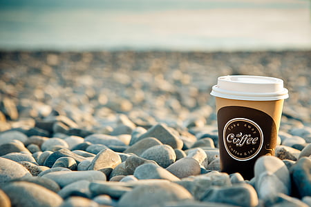 Coffee cup on stones