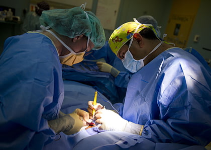 surgeons having medical operation inside operating room