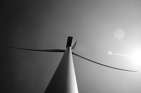 worm's-eye view of wind turbine under clear sky