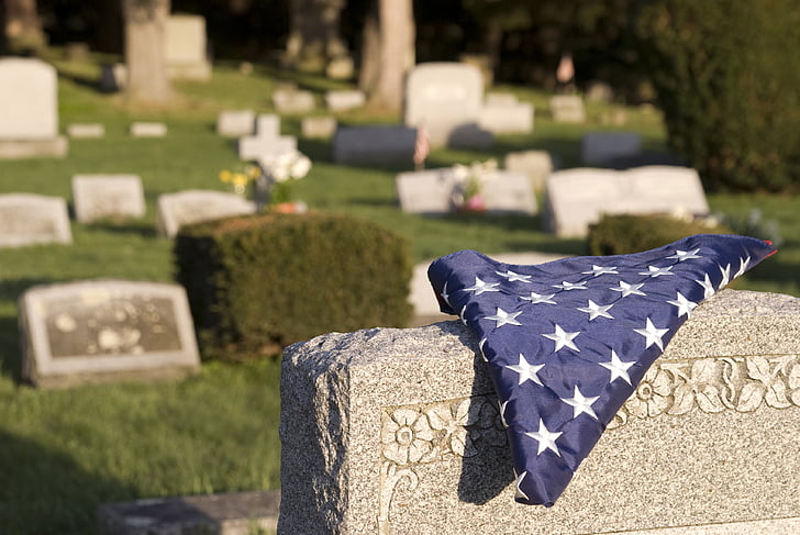 blue country flag on gray tomb