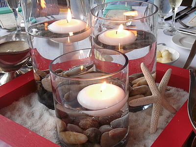photo of lighted gel candles on table