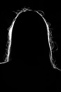 silhouette photo of long-haired person
