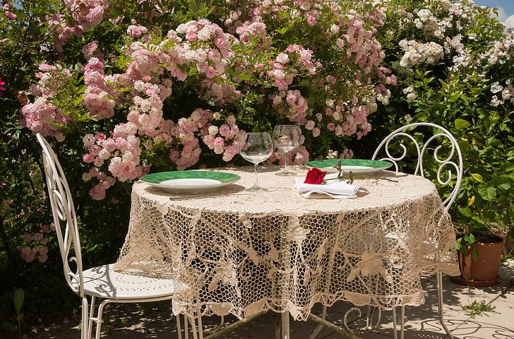 round white table with beige lace table mat at daytime