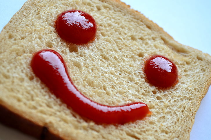 wheat bread with hammy emoji ketchup decor