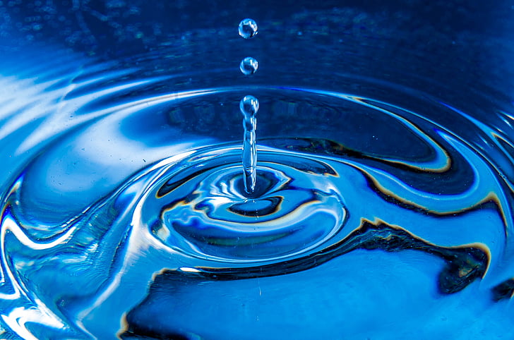 Closeup Shot Of Water Drop In Dark Blue Shade Stock Photo - Download Image  Now - Rippled, Water, Drop - iStock