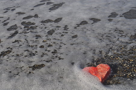 heart-shaped rock in beach