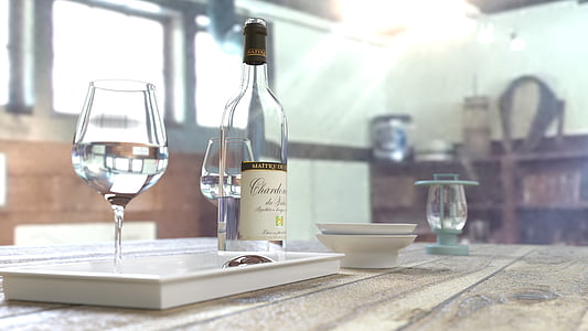 wine bottle beside wine glasses on tray on table