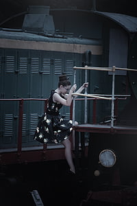 woman climbing at stage near locker