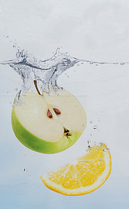 sliced granny smith apple and lemon fruit in water