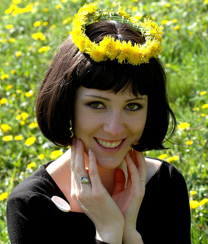 woman wearing a yelow flower halo