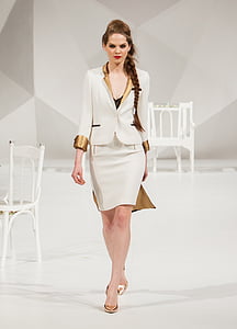 woman wearing white blazer and white skirt