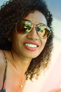 woman in silver-colored aviator-style sunglasses