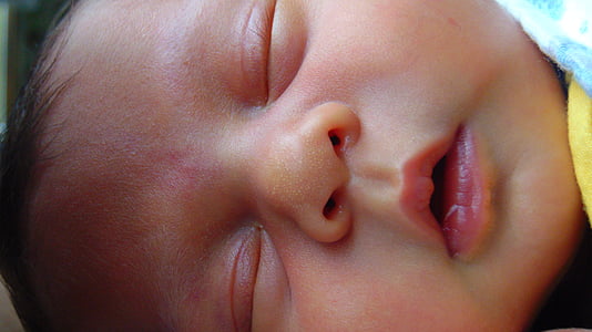 closeup photo of baby's face