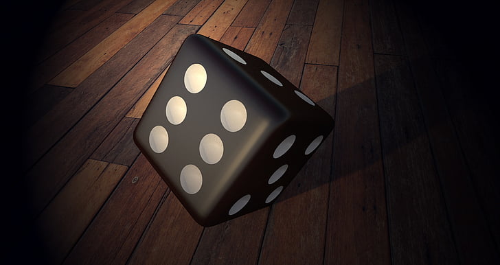 black dice on wooden floor