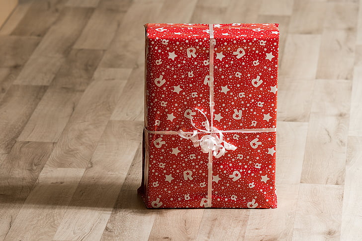 red and gray star print gift box on the floor