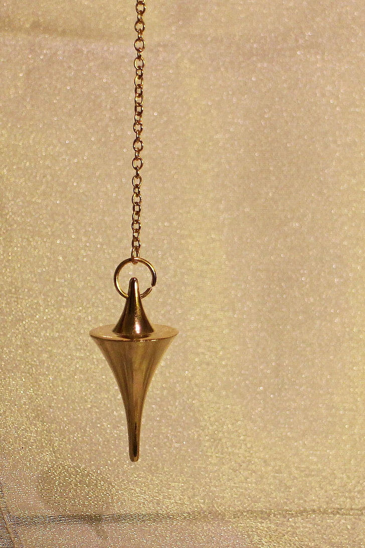 gold-colored pendulum