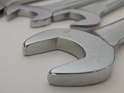 three gray open-head wrenches