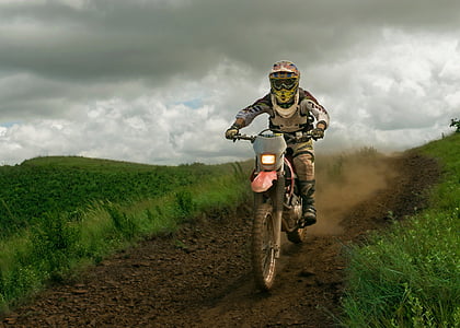 man riding on motocross dirt bike