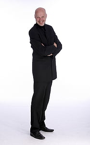smiling man wearing black suit jacket