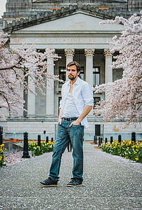 man standing in front of Legislative Building at daytime