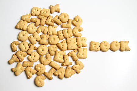 closeup photography of pile of letter biscuits