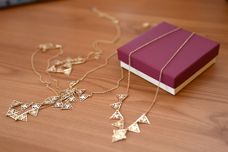 photo of gold-colored necklace
