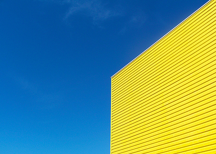yellow painted building under blue sky during daytime