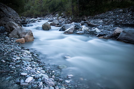 time lapse photography of flowing river near trees