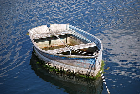 brown boat on body of water during daytime