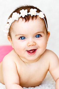 toddler wearing white floral headband