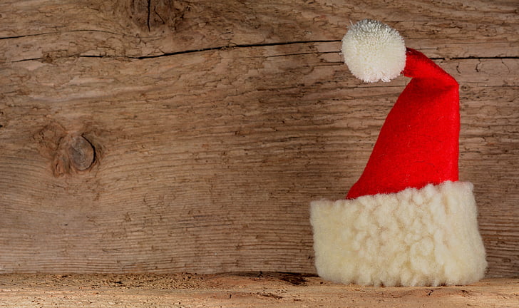 Santa hat on wooden surface