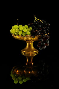 bunch of green and purple grapes on footed tray