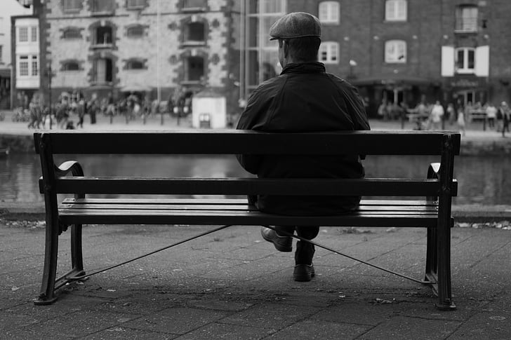 person sitting on bench profile