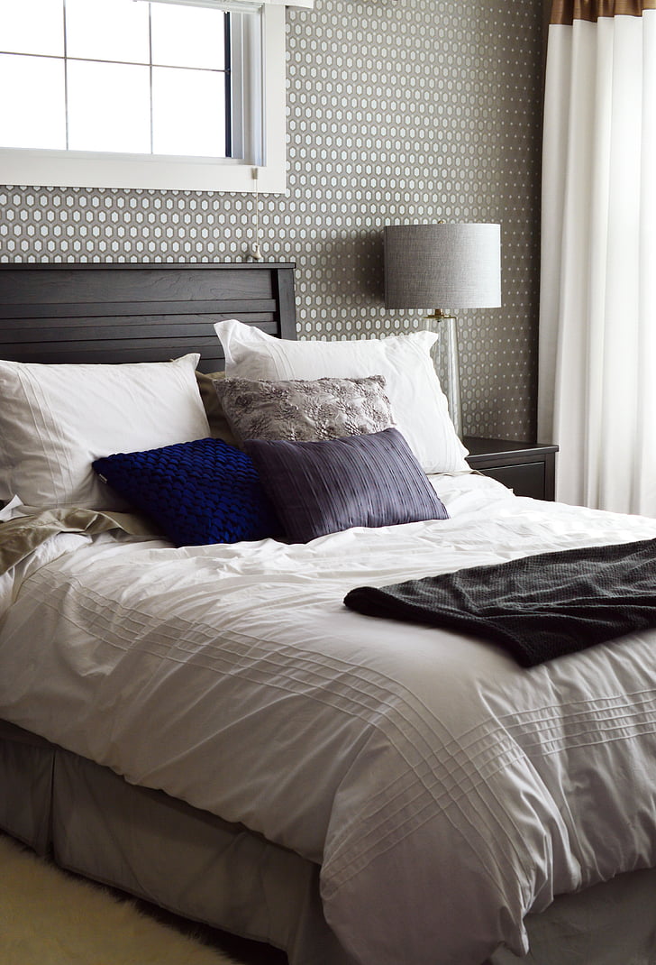 black bed frame with white comforter set