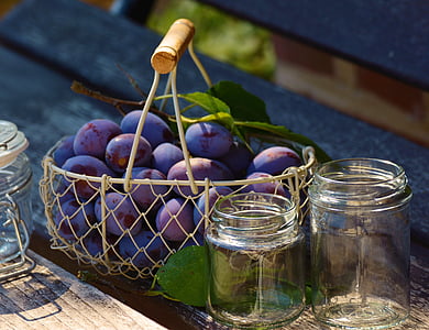purple grape fruits on basket