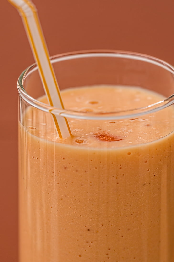 closeup photo of orange smoothie