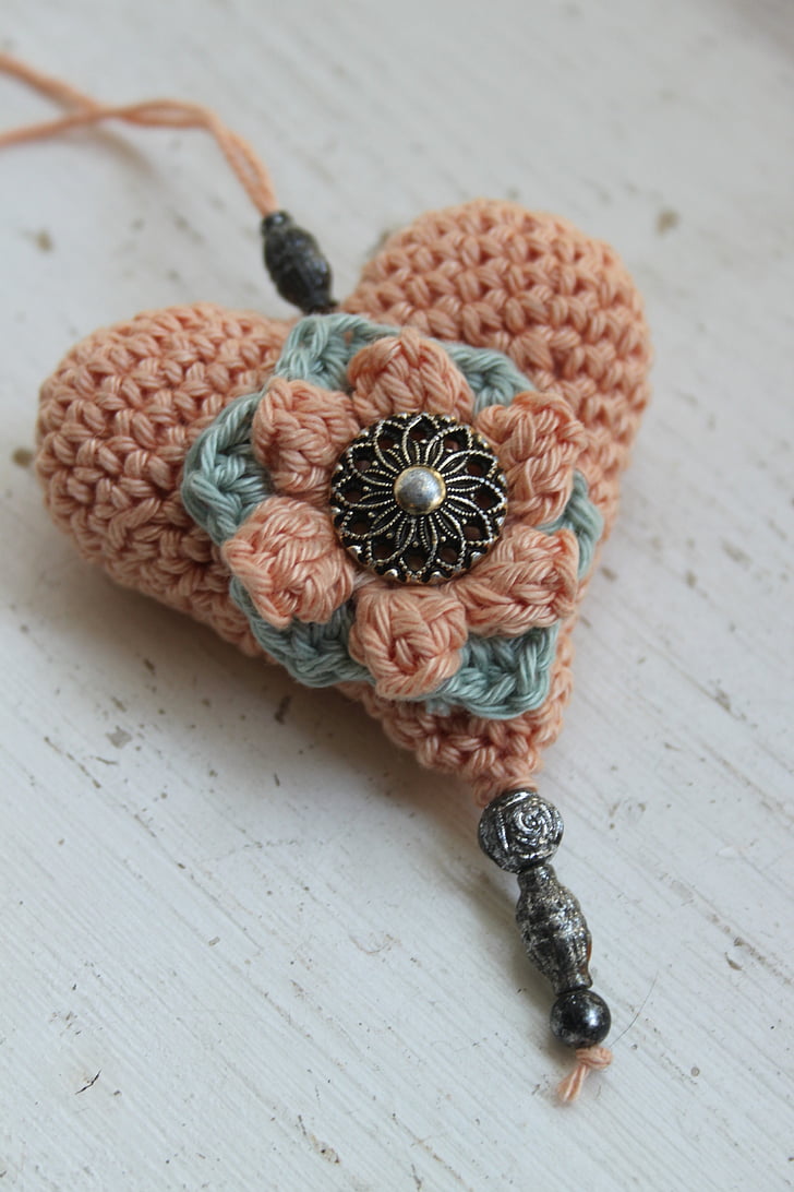 closeup photo of heart knit pendant