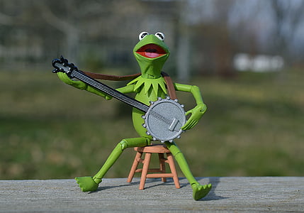 Kermit the frog playing banjo