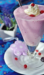 berry shake with whip cream on top