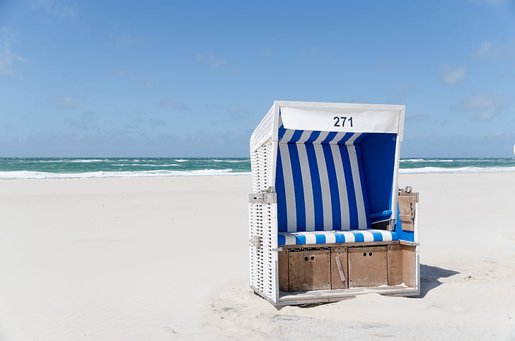 white and brown wooden stall in beach
