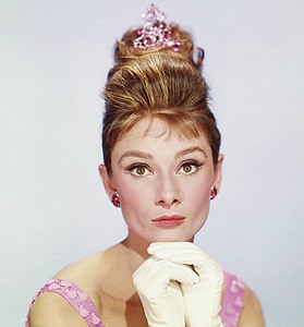 woman wearing crown and white gloves