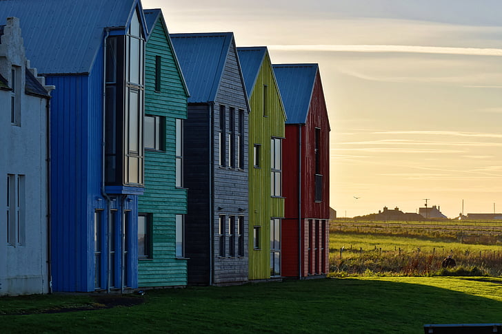blue, green, gray, yellow, and red wooden houses