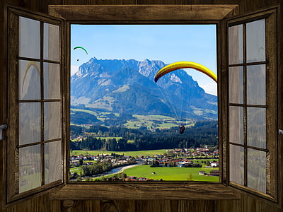 man paragliding view front the window