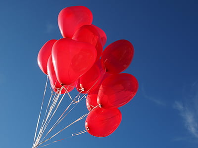 low angle photo of red balloons