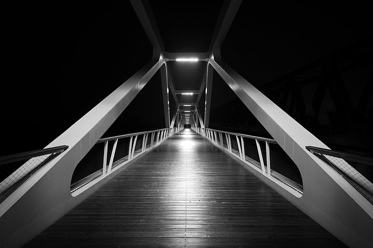 grayscale photo of suspension bridge