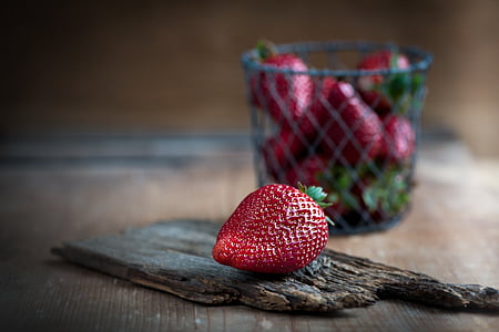strawberry on brown wood board
