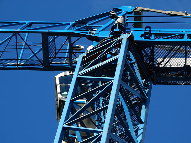 blue and white crane under blue sky during daytime