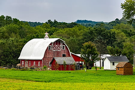 red barn under cloudy sky