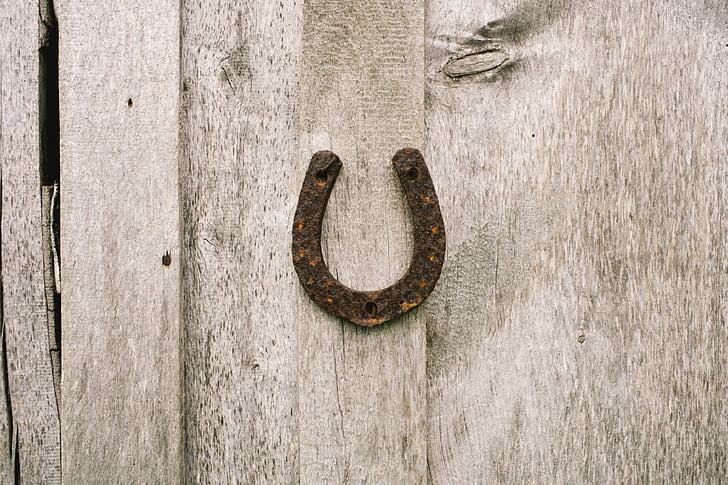 rusty horseshoe on wall